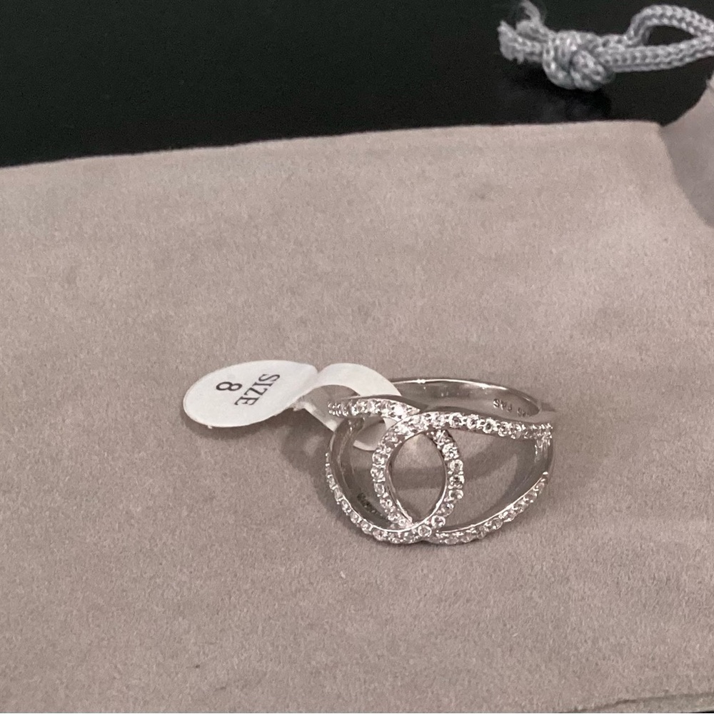New with pouch 925 Silver Infinity  Rhodium plated Ring